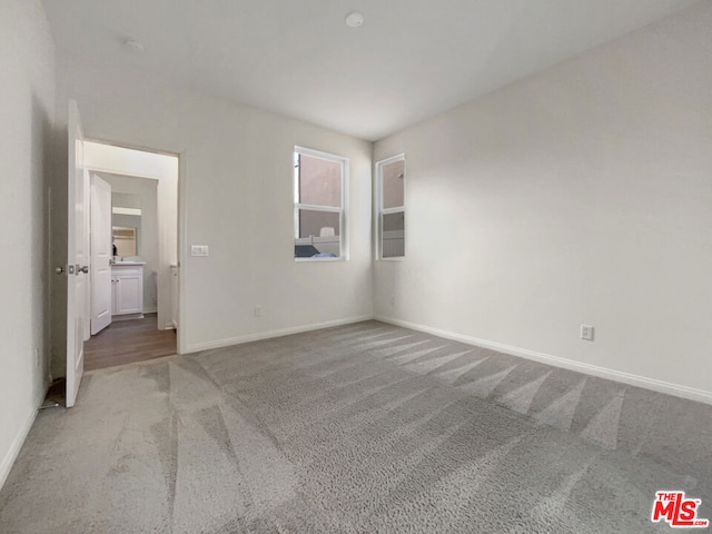 unfurnished bedroom with carpet flooring