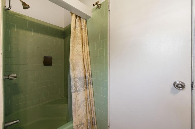 bathroom with shower / bath combination with curtain