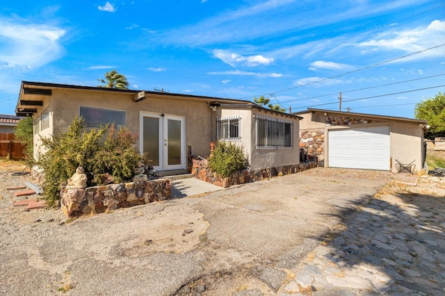 single story home featuring a garage