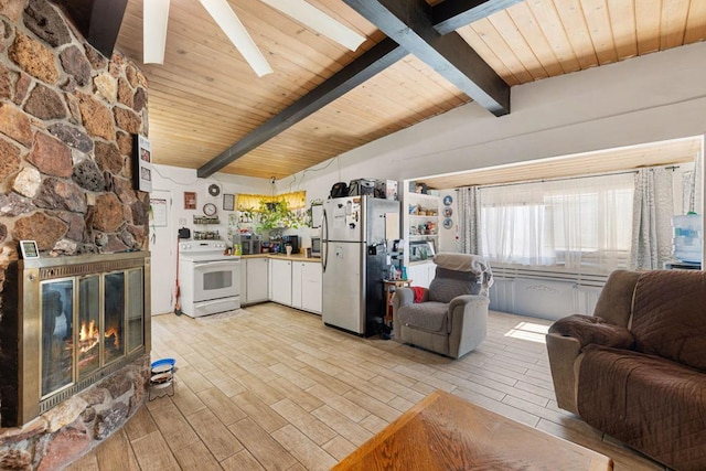 living room with a stone fireplace, wooden ceiling, and lofted ceiling with beams