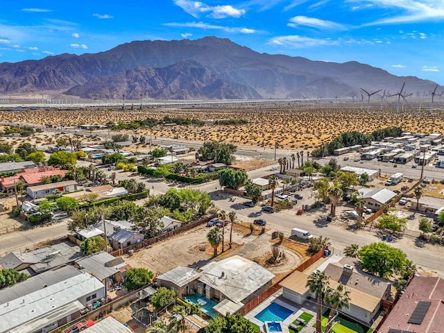 birds eye view of property with a mountain view