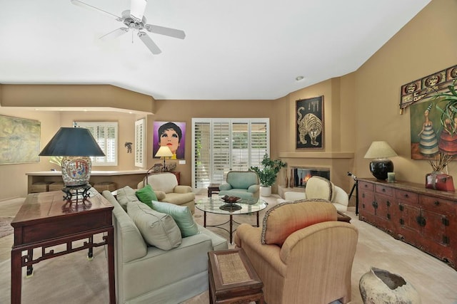 living room with ceiling fan and light colored carpet