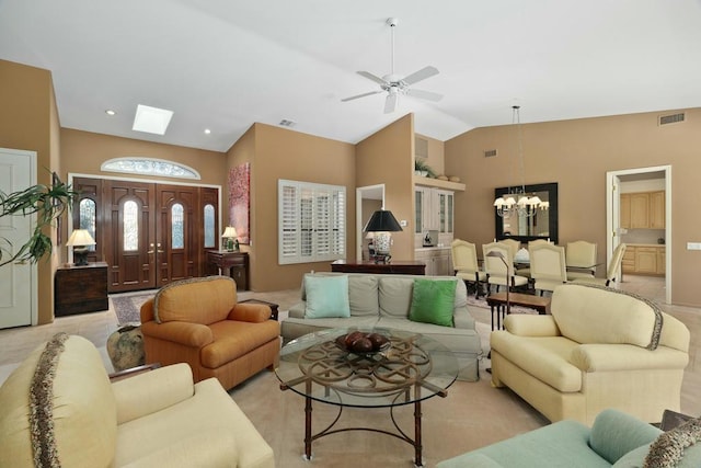 living room with light carpet, ceiling fan with notable chandelier, and lofted ceiling