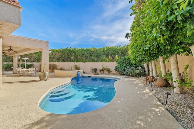 view of pool featuring ceiling fan and a patio