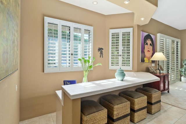 dining space featuring light tile patterned floors