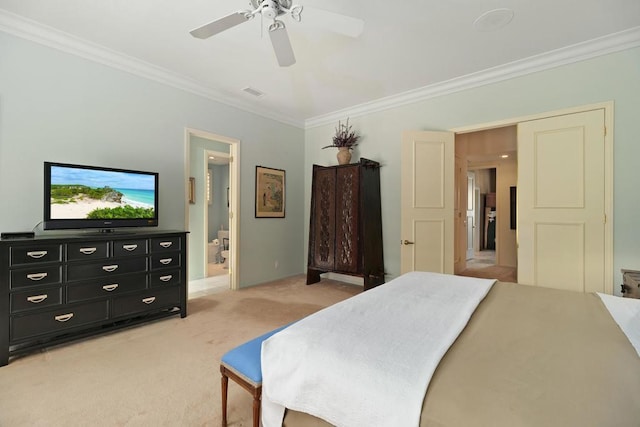 carpeted bedroom featuring ensuite bathroom, ceiling fan, and ornamental molding