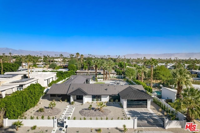 birds eye view of property featuring a mountain view