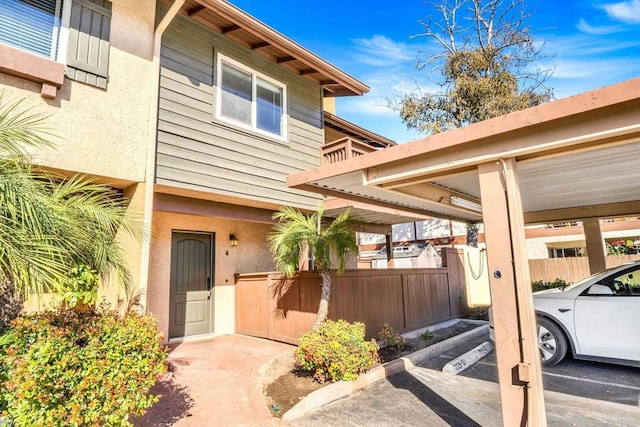 property entrance with a carport