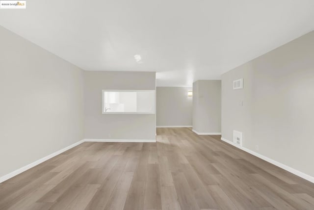 empty room featuring light hardwood / wood-style floors