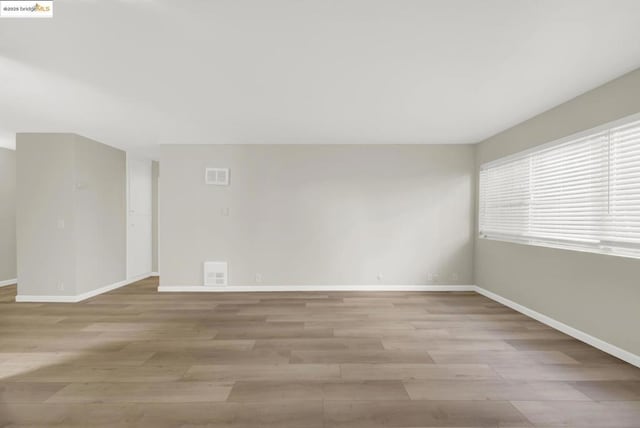 empty room with light wood-type flooring