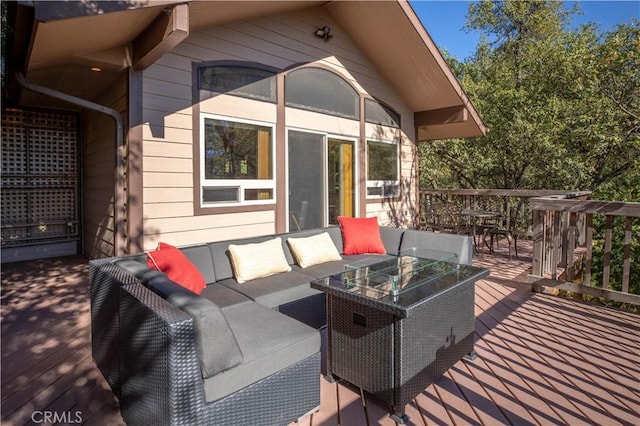 wooden terrace featuring an outdoor hangout area