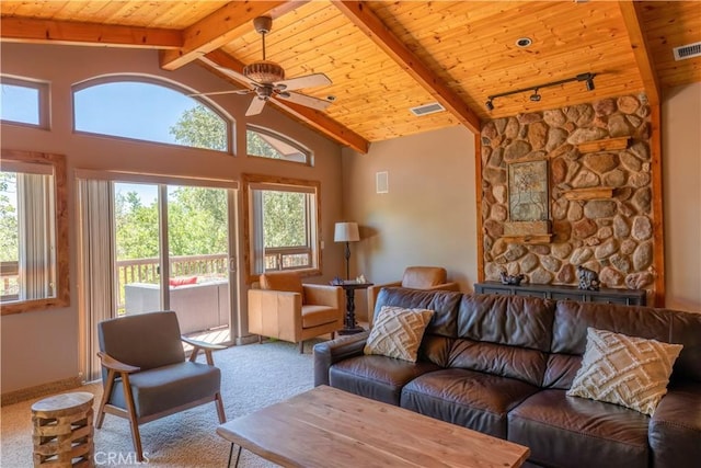 living room with carpet, beam ceiling, and ceiling fan