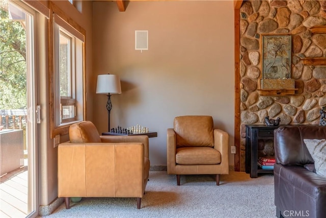 sitting room featuring light carpet