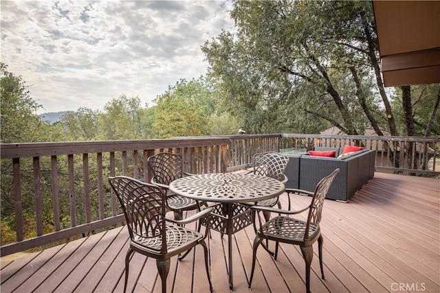 wooden terrace featuring an outdoor hangout area