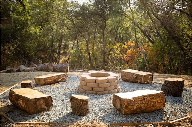 view of patio / terrace featuring an outdoor fire pit