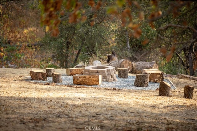 view of yard with a fire pit