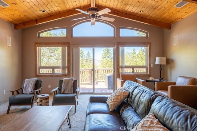 living room featuring carpet, vaulted ceiling with beams, and ceiling fan