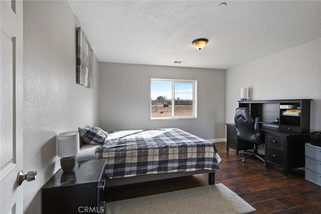7755 7th St, Phelan, CA 92371 - bedroom with wood finished floors and a textured ceiling
