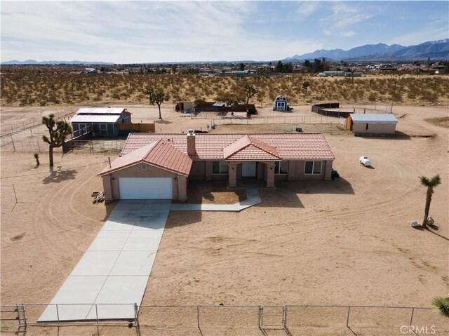 birds eye view of property featuring a mountain view