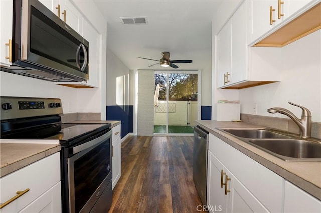 kitchen with white cabinetry, sink, ceiling fan, and appliances with stainless steel finishes