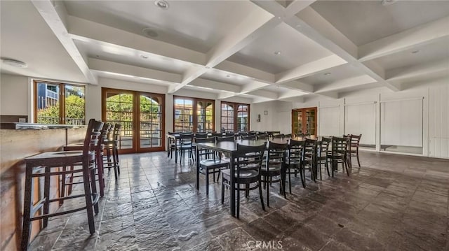 dining room with french doors, beamed ceiling, and coffered ceiling