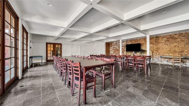 6435 Green Valley Cir Unit 214, Culver City, CA 90230 - dining room with coffered ceiling, beam ceiling, french doors, and brick wall