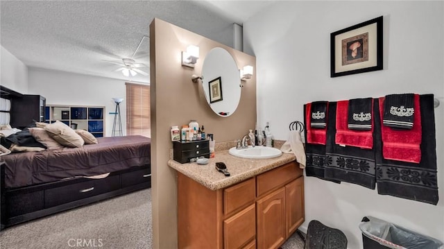 6435 Green Valley Cir Unit 214, Culver City, CA 90230 - ensuite bathroom with ceiling fan, vanity, and a textured ceiling