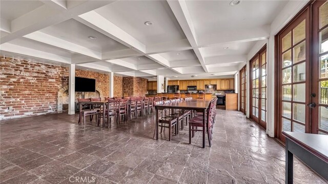 dining space featuring french doors, brick wall, beam ceiling, and coffered ceiling