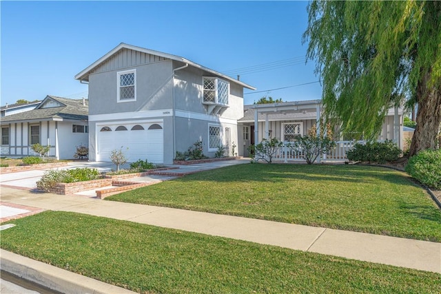 view of front property featuring a garage and a front yard