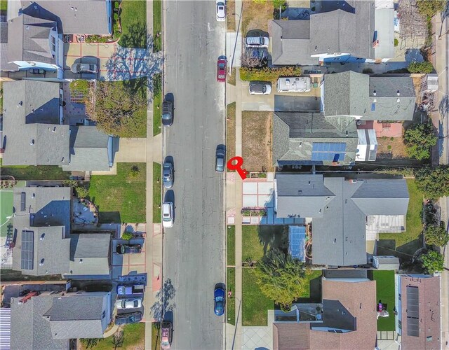 birds eye view of property with a residential view