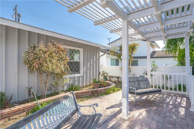 view of patio / terrace with fence and a pergola