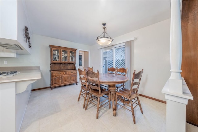 dining space featuring baseboards