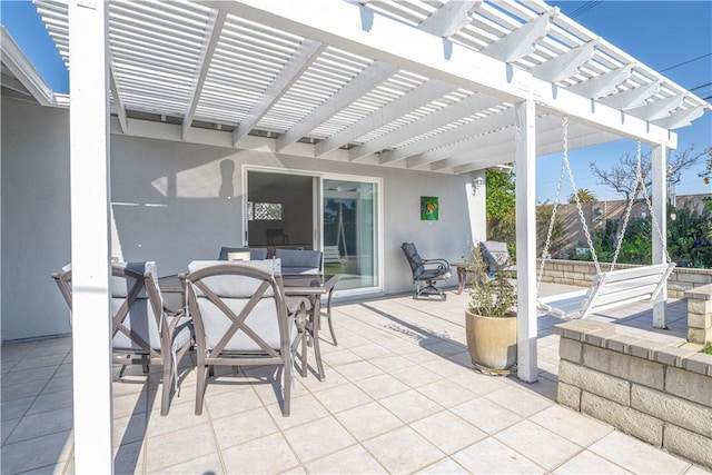 view of patio / terrace featuring outdoor dining area, fence, and a pergola