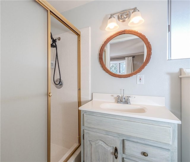 bathroom featuring a stall shower and vanity