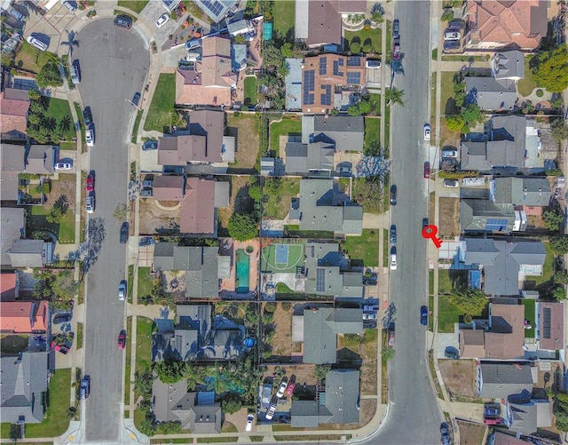 birds eye view of property with a residential view