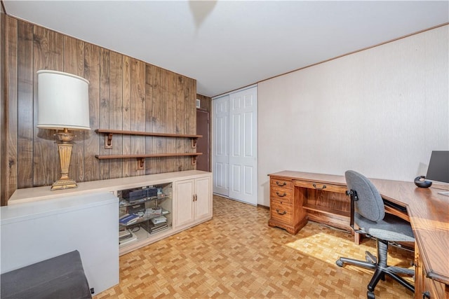 home office featuring wood walls