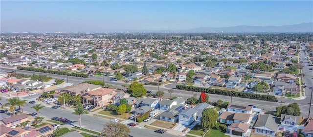 birds eye view of property with a mountain view and a residential view