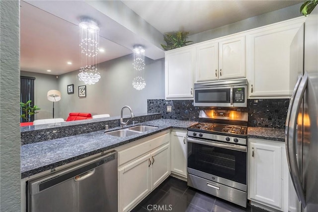 kitchen with white cabinetry, stainless steel appliances, and sink