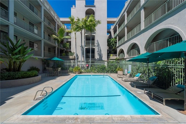 view of swimming pool with a patio