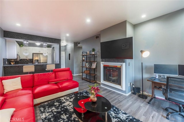 living room with wood-type flooring