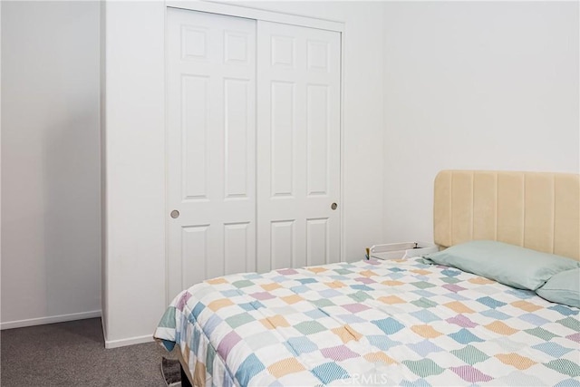 carpeted bedroom with a closet