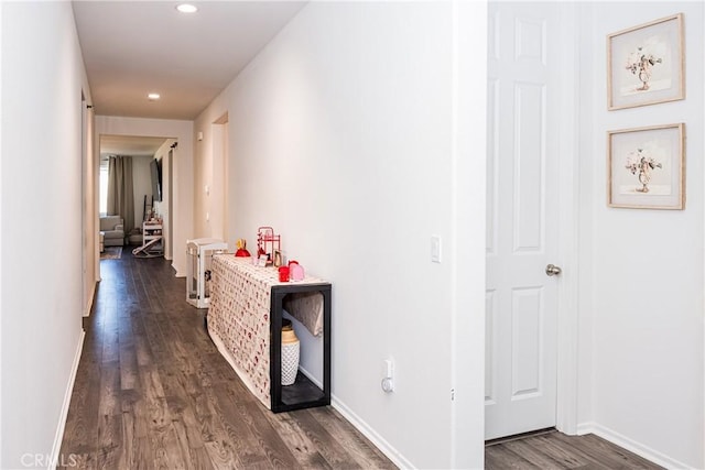 hallway featuring dark wood-type flooring