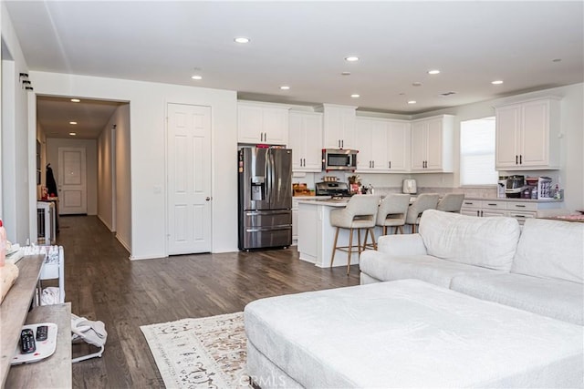 living room featuring dark hardwood / wood-style flooring