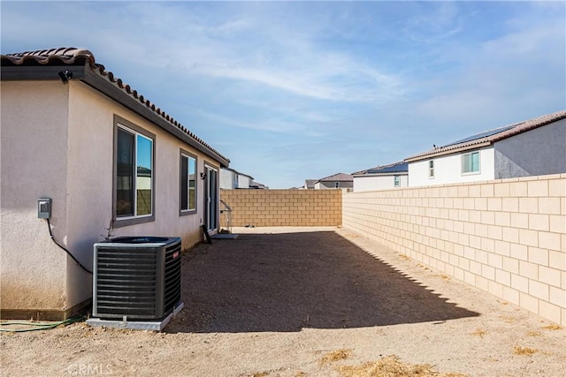 view of yard with central AC unit