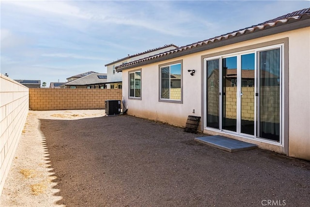 rear view of house with cooling unit