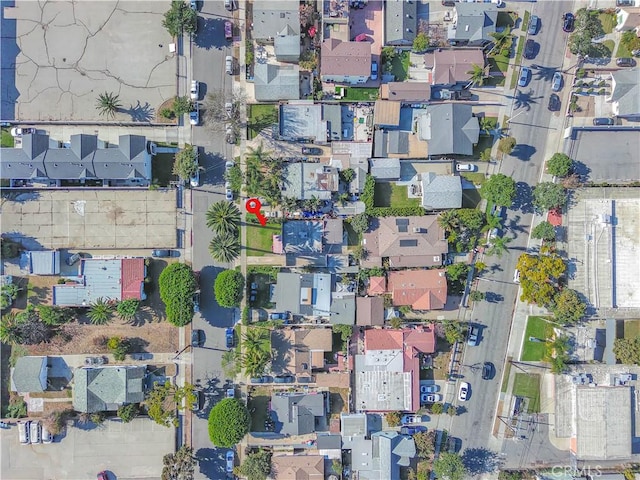 birds eye view of property with a residential view