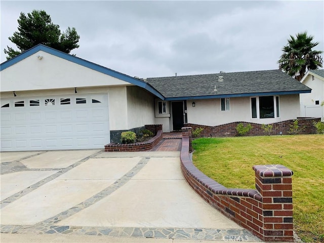 single story home featuring a front lawn and a garage