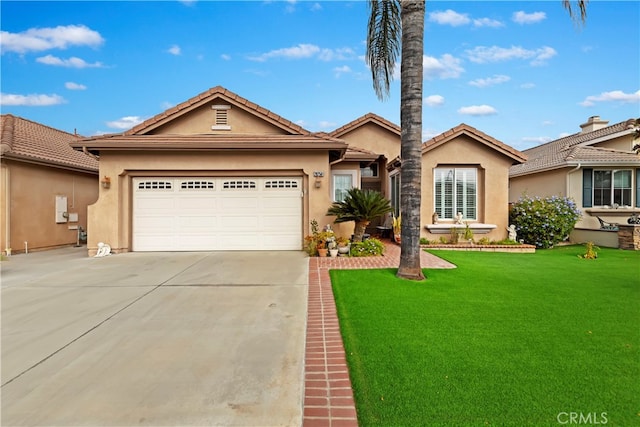 single story home with a garage and a front lawn