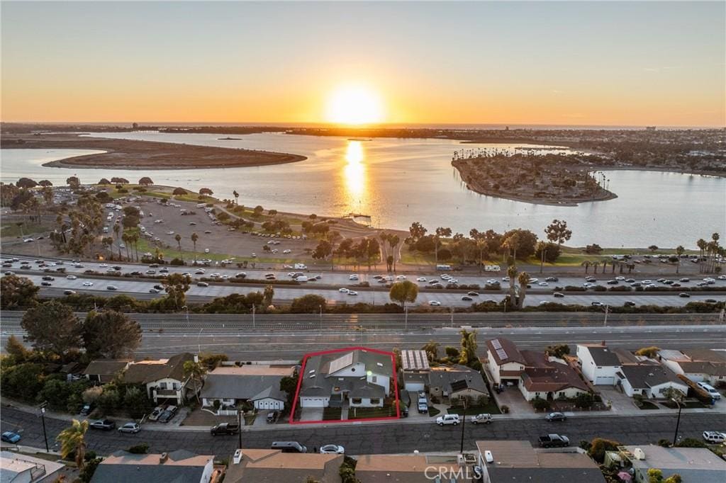 aerial view at dusk with a water view