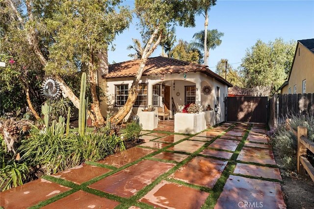 mediterranean / spanish home with a patio area